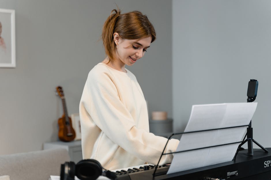 Young woman playing an electric piano indoors, smiling while reading sheet music.